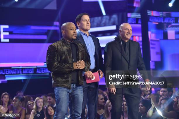 Daymond John, Mark Cuban, and Kevin O'Leary speak onstage during the 2017 American Music Awards at Microsoft Theater on November 19, 2017 in Los...