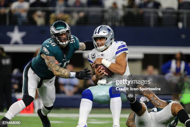 Dallas Cowboys quarterback Dak Prescott gets sacked by Philadelphia Eagles defensive end Chris Long and defensive end Derek Barnett during the game...