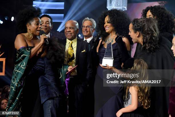 Guests, such as Smokey Robinson , Berry Gordy , host Tracee Ellis Ross stand onstage as Rhonda Ross Kendrick presents the Lifetime Achievement award...