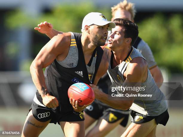 Jarman Impey of the Hawks is tackled by Jaeger O'Meara during a Hawthorn Hawks AFL pre-season training session at Waverley Park on November 20, 2017...