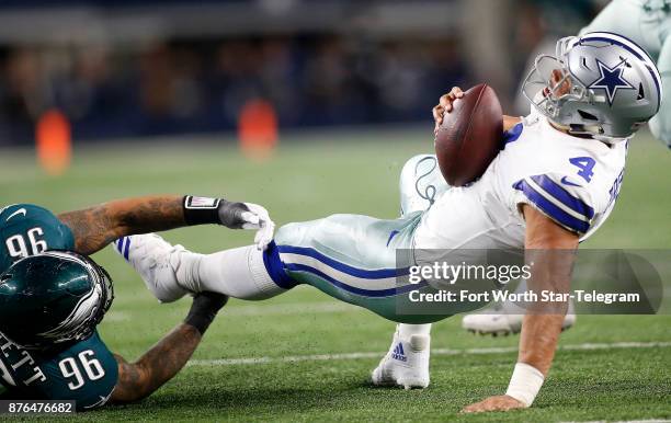 Dallas Cowboys quarterback Dak Prescott is sacked by Philadelphia Eagles defensive end Derek Barnett in the first half on Sunday, Nov. 19, 2017 at...