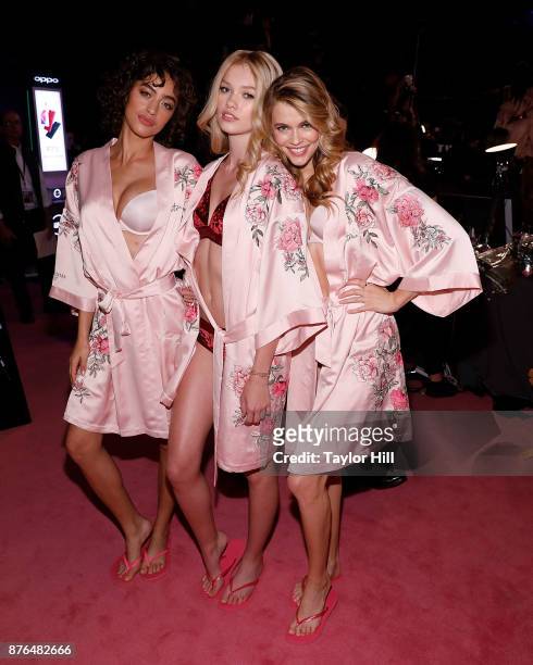 Alanna Arrington, Maggie Lane, and Megan Williams prepare for the 2017 Victoria's Secret Fashion Show in hair and make-up on November 20, 2017 at...