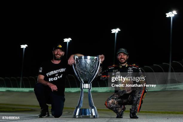 Martin Truex Jr., driver of the Bass Pro Shops/Tracker Boats Toyota, and his crew chief Cole Pearn pose with the Monster Energy NASCAR Cup Series...