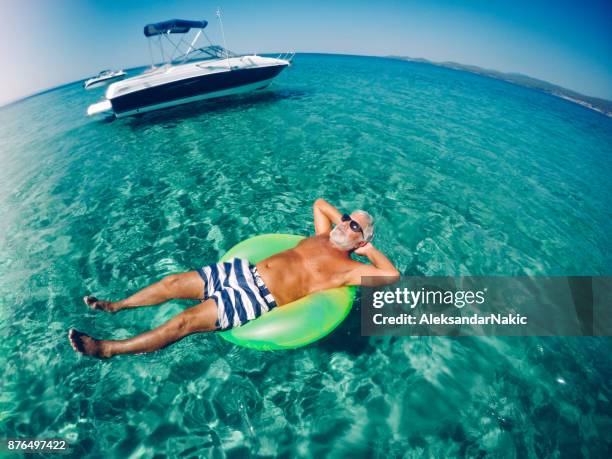 life is good! - man on float stock pictures, royalty-free photos & images