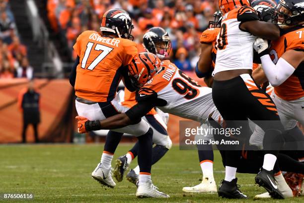 Denver Broncos quarterback Brock Osweiler is sacked by Cincinnati Bengals defensive end Carlos Dunlap during the second quarter. The Denver Broncos...