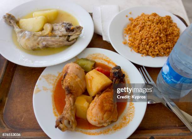 asia, turkey, mugla, marmaris area, 2017: view of turkish meal at non-tourist restaurant frequented by locals. cost for three servings and a small bottle of water 9 turkish lira (2.70 euro / $3usd). - non potable stock pictures, royalty-free photos & images