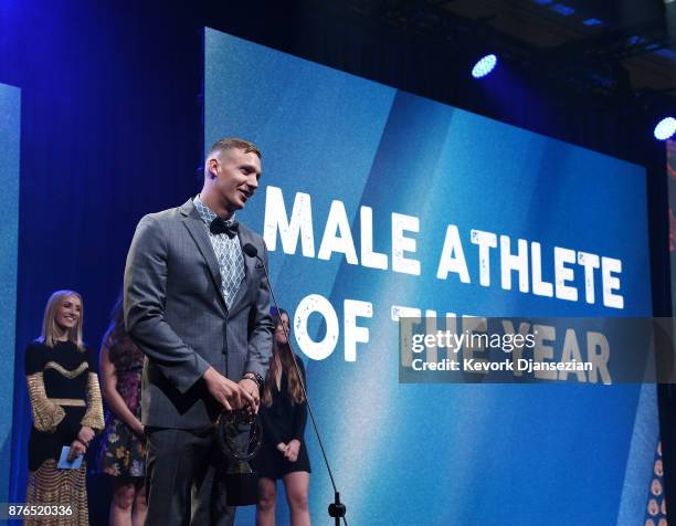 Caeleb Dressel accepts the Golden Goggle Award for Male Athlete of the Year during the 2017 USA Swimming Golden Goggle Awards at J.W. Marriott at...