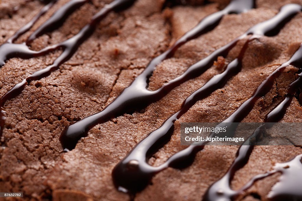 Chocolate sauce drizzled on brownie