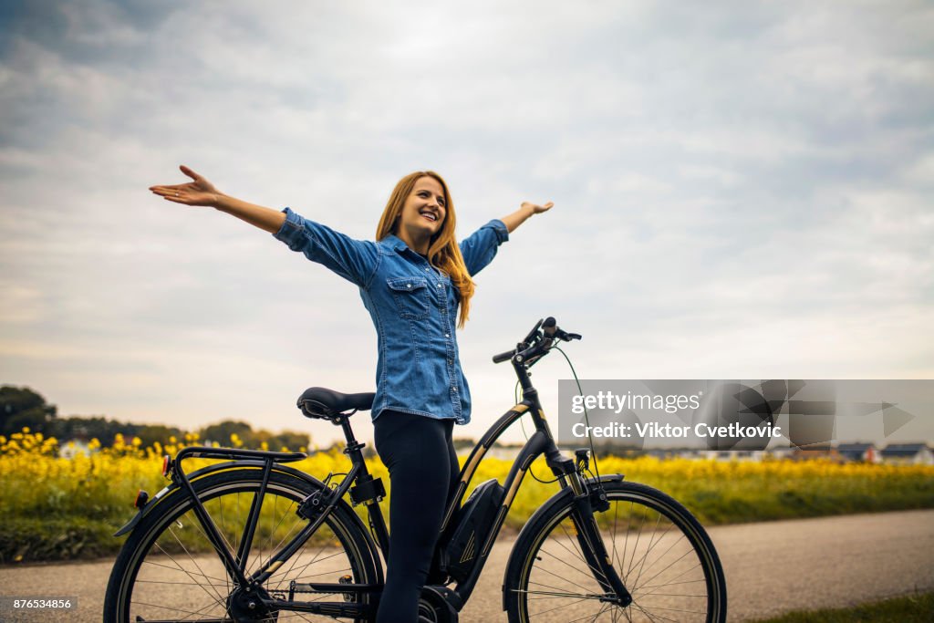 Woman riding on her Electric Bike
