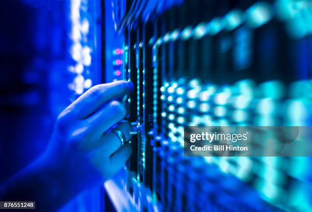 network server technician - hand adjusting stock pictures, royalty-free photos & images