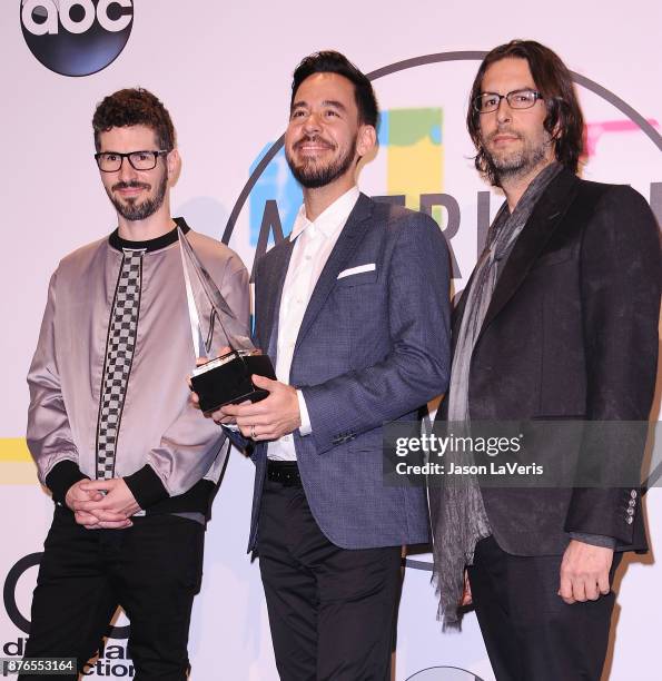 Brad Delson, Mike Shinoda and Rob Bourdon of Linkin Park pose in the press room at the 2017 American Music Awards at Microsoft Theater on November...