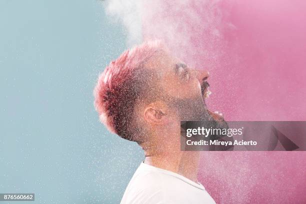 portrait of male with pink hair - stress resistant stockfoto's en -beelden