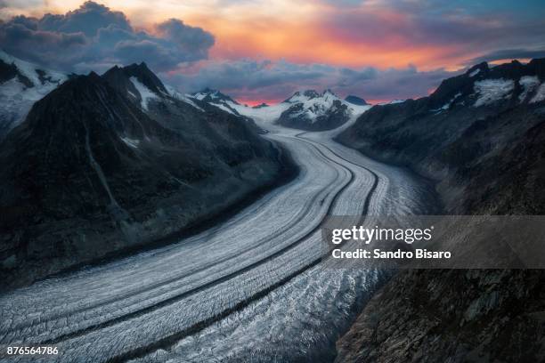 aletsch glacier on a cloudy sunset - aletsch glacier stock pictures, royalty-free photos & images