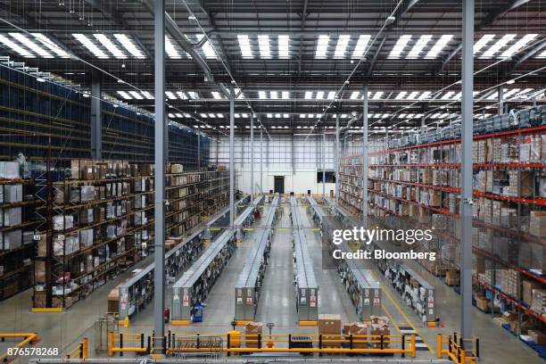 Goods sit on shelves in the manual selection stock pick area of the John Lewis Plc customer fulfilment and distribution centre in Milton Keynes,...