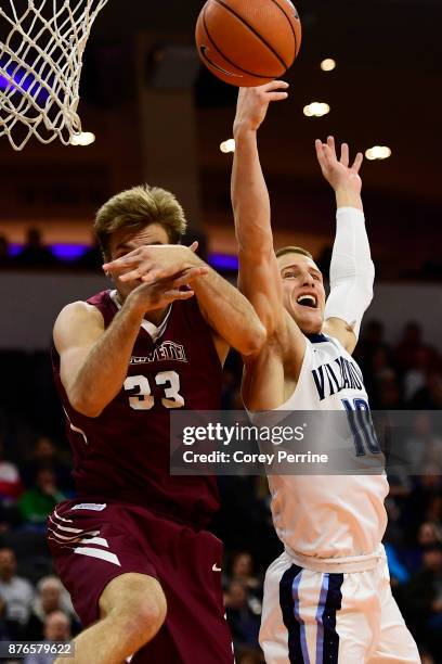 Donte DiVincenzo of the Villanova Wildcats knocks he ball from Paulius Zalys of the Lafayette Leopards during the first half at the PPL Center on...