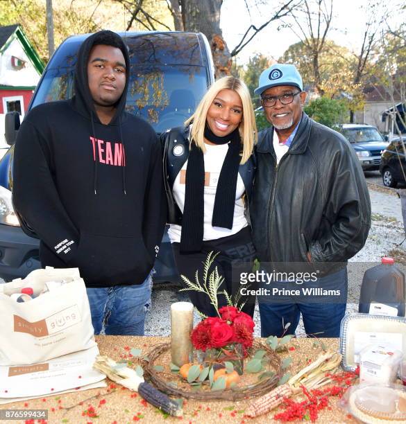 Brentt Leakes, Nene Leakes and Gregg Leakes attend Thanksgiving Meal Giveaway With Nene and Marlo at Gio's on November 19, 2017 in Atlanta, Georgia.