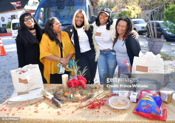 Nene Leakes and Marlo Hampton attend Thanksgiving meal Giveaway with Nene and Marlo at Gio's on November 19, 2017 in Atlanta, Georgia.