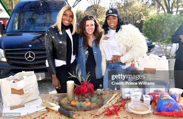 Nene Leaks and Marlo Hampton attend Thanksgiving Meal Giveaway with Nene and Marlo at Gio's on November 19, 2017 in Atlanta, Georgia.