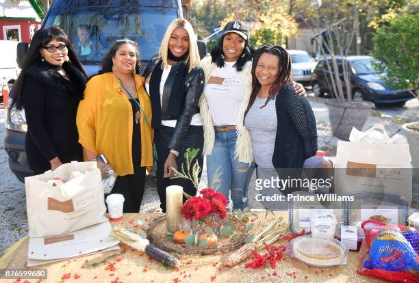 Nene Leaks and Marlo Hampton attend Thanksgiving Meal Giveaway with Nene and Marlo at Gio's on November 19, 2017 in Atlanta, Georgia.