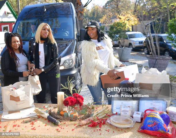 Nene Leakes and Marlo Hampton attend Thanksgiving meal Giveaway with Nene and Marlo at Gio's on November 19, 2017 in Atlanta, Georgia.