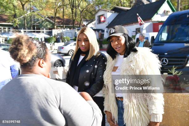 Nene Leaks and Marlo Hampton attend Thanksgiving Meal Giveaway with Nene and Marlo at Gio's on November 19, 2017 in Atlanta, Georgia.