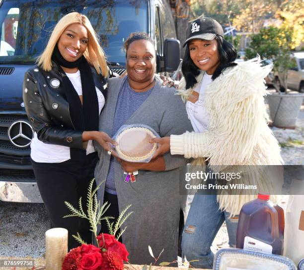 Nene Leaks and Marlo Hampton attend Thanksgiving Meal Giveaway with Nene and Marlo at Gio's on November 19, 2017 in Atlanta, Georgia.