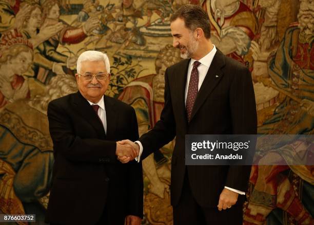 Palestinian President Mahmoud Abbas and King Felipe VI of Spain shake hands as they gesture at Palace of Zarzuela in Madrid, Spain on November 20,...