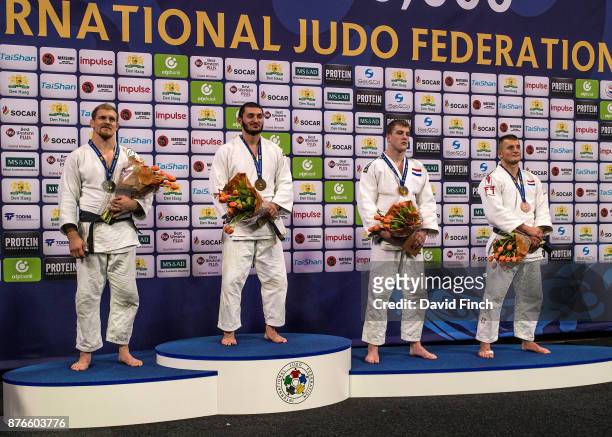 Under 100kg medallists L-R: Silver; Joakim Dvarby , Gold; Kazbek Zankishiev , Bronzes; Jelle Snippe and Michael Korrel during the The Hague Grand...