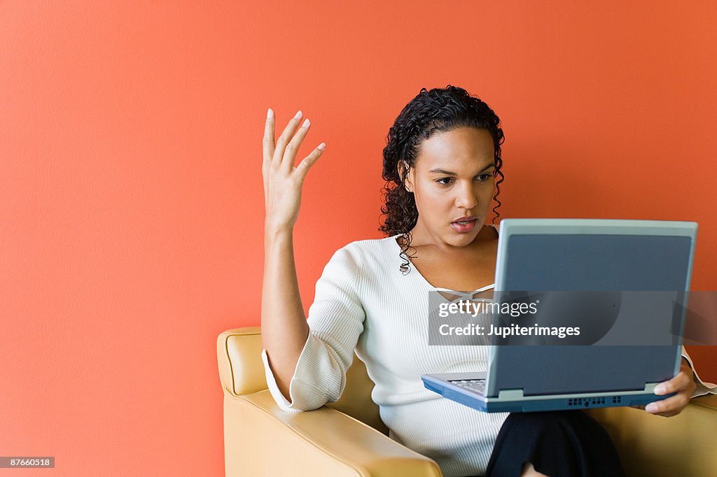 Frustrated businesswoman with laptop computer