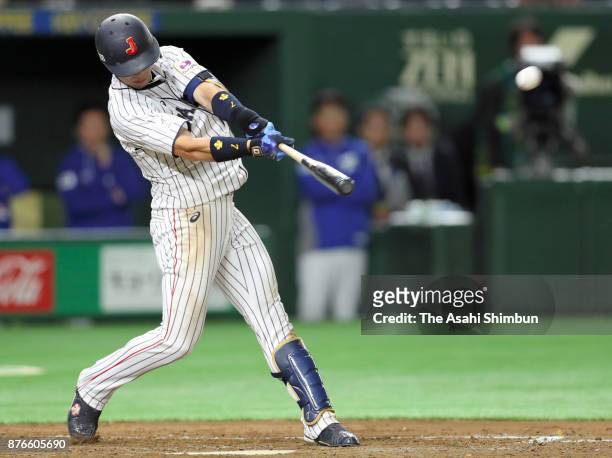 Infielder Shuta Tonosaki of Japan hits a RBI double to make it 1-0 in the bottom of fourth inning during the Eneos Asia Professional Baseball...