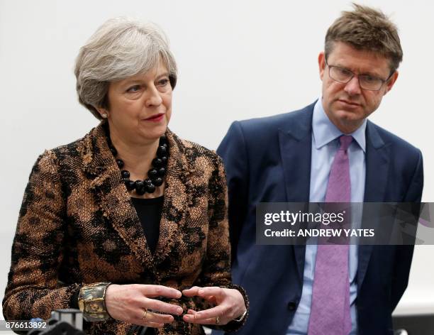 Britain's Prime Minister Theresa May and Britain's Business, Energy and Industrial Strategy Secretary Greg Clark visit an engineering training...