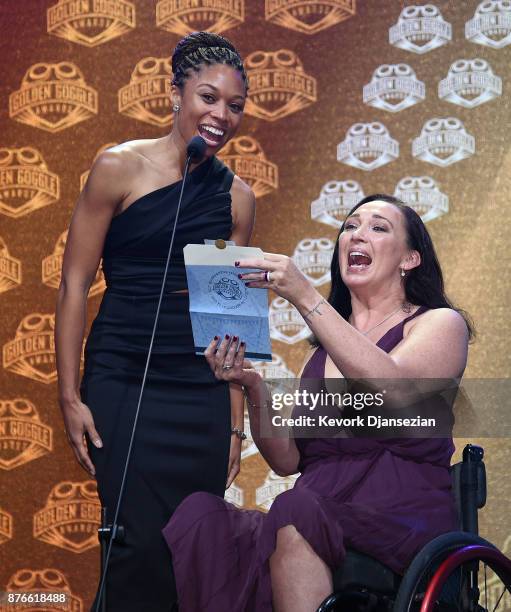 Allison Felix and Amy Van Dyken announce he winner of Perseverance Award during the 2017 USA Swimming Golden Goggle Awards at J.W. Marriott at L.A....