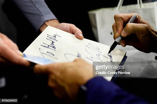 Head coach Jay Wright of the Villanova Wildcats signs a book after the game against the Lafayette Leopards at the PPL Center on November 17, 2017 in...