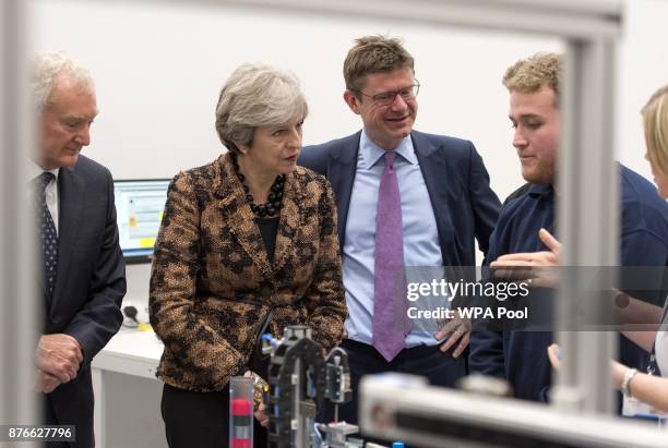 Prime Minister Theresa May and Secretary of State for Business Greg Clark visit an engineering training facility on November 20, 2017 in Birmingham,...