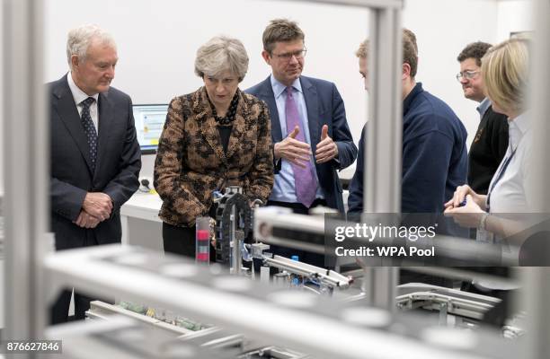 Prime Minister Theresa May and Secretary of State for Business Greg Clark visit an engineering training facility on November 20, 2017 in Birmingham,...
