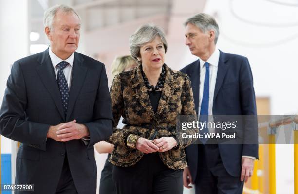 Prime Minister Theresa May and Chancellor of the Exchequer Philip Hammond visit an engineering training facility on November 20, 2017 in Birmingham,...