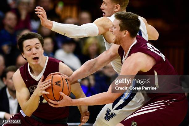 Matt Klinewski of the Lafayette Leopards is called on this handoff to teammate Justin Jaworski as Donte DiVincenzo of the Villanova Wildcats defends...