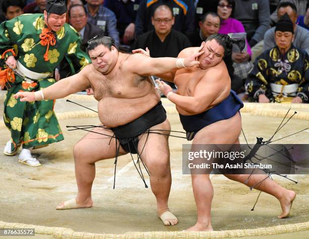 Ozeki Takayasu and sekiwake Mitakeumi compete during day nine of the Grand Sumo Kyushu Tournament at Fukuoka Convention Center on November 20, 2017...