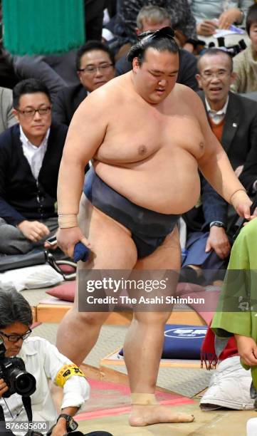 Yokozuna Kisenosato leaves the ring after his defeat by Takarafuji during day nine of the Grand Sumo Kyushu Tournament at Fukuoka Convention Center...