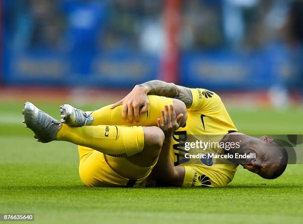 Dario Benedetto of Boca Juniors reacts after being injured during a match between Boca Juniors and Racing Club as part of the Superliga 2017/18 at...