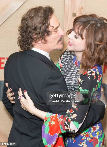 Kim Coates & Audrey Moore wearing dress by Rixo attend Netflix Godless premiere at Metrograph.