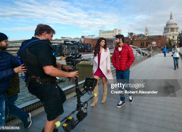 Videographer Mike Scott shoots a scene for the fourth installment of the Bollywood 'Hate Story' film series on Millennium Bridge in London, England....