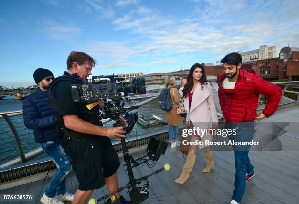 Videographer Mike Scott shoots a scene for the fourth installment of the Bollywood 'Hate Story' film series on Millennium Bridge in London, England....