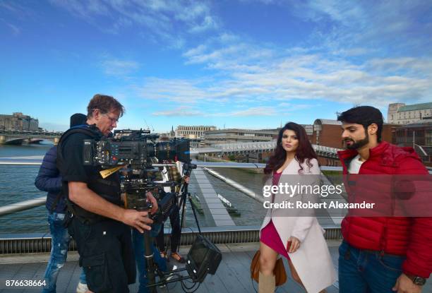 Videographer Mike Scott shoots a scene for the fourth installment of the Bollywood 'Hate Story' film series on Millennium Bridge in London, England....