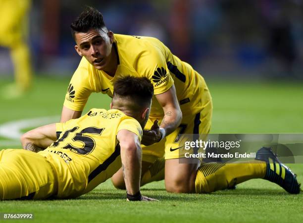 Cristian Pavon of Boca Juniors talks to Nahitan Nandez of Boca Juniors during a match between Boca Juniors and Racing Club as part of the Superliga...