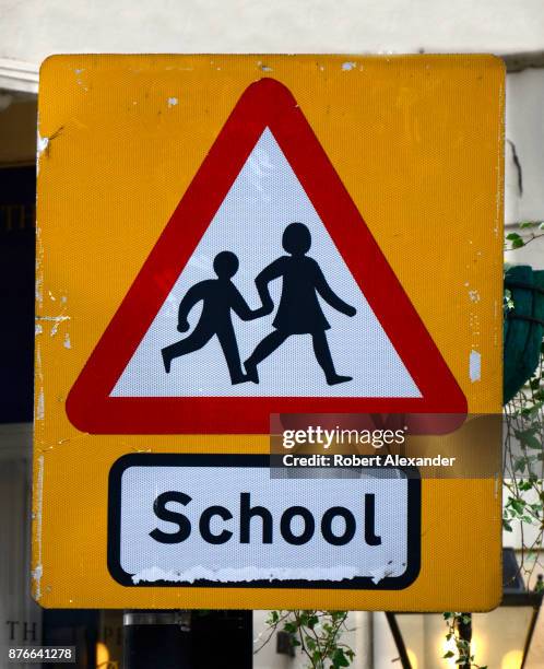 Road sign warns motorists in London, England, that children may be crossing the road in front of a school.