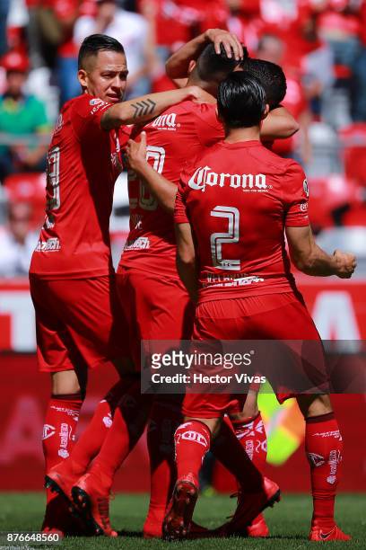Fernando Uribe of Toluca celebrates with teammates after scoring the first goal of his team during the 17th round match between Toluca and Tijuana as...