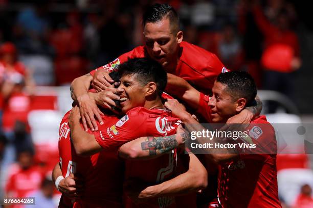 Fernando Uribe of Toluca celebrates with teammates after scoring the second goal of his team during the 17th round match between Toluca and Tijuana...