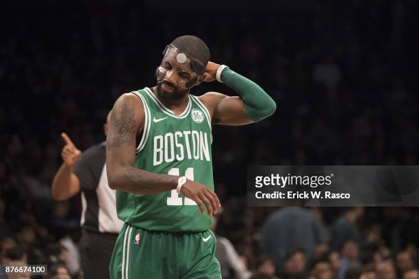 Boston Celtics Kyrie Irving wearing face mask during game vs Brooklyn Nets at Barclays Center. Brooklyn, NY CREDIT: Erick W. Rasco