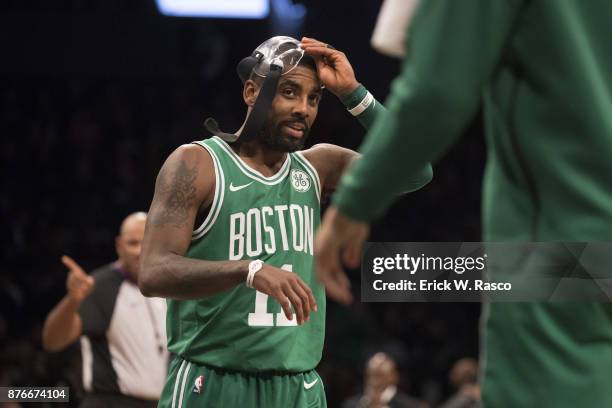 Boston Celtics Kyrie Irving wearing face mask during game vs Brooklyn Nets at Barclays Center. Brooklyn, NY CREDIT: Erick W. Rasco